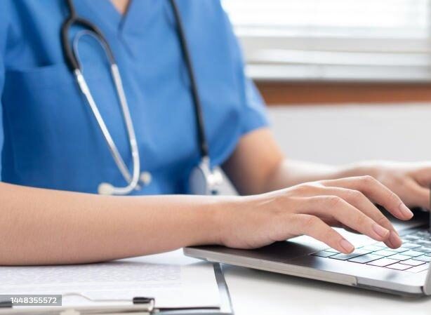 Nurse using laptop
