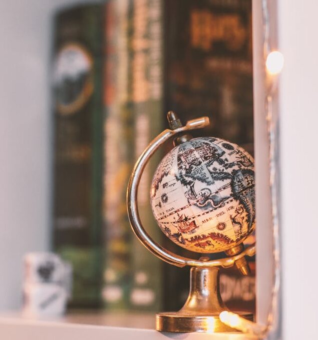 shelf with globe and books on it